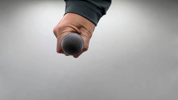 istock Drop the Mic on Sequence - Male Hand Black Mic 1475079094