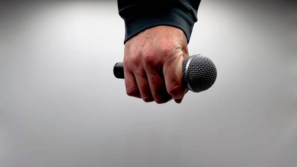 istock Drop the Mic on Sequence - Male Hand Black Mic 1475079098