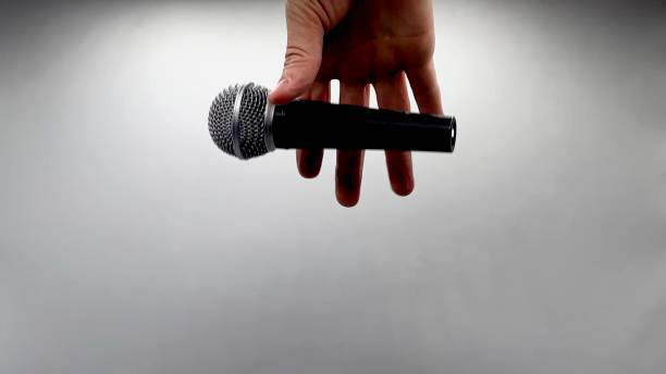 istock Drop the Mic on Sequence - Male Hand Black Mic 1475079107