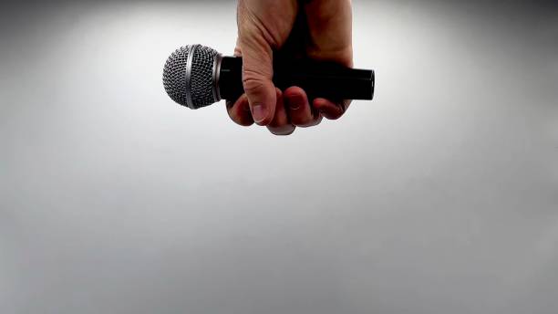 istock Drop the Mic on Sequence - Male Hand Black Mic 1475079112