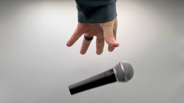 istock Drop the Mic on Sequence - Male Hand Black Mic 1475079120