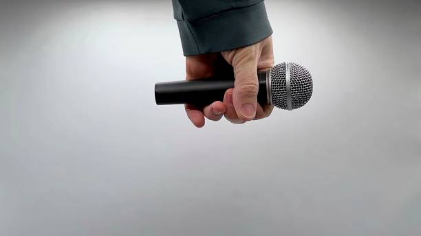 istock Drop the Mic on Sequence - Male Hand Black Mic 1475079121