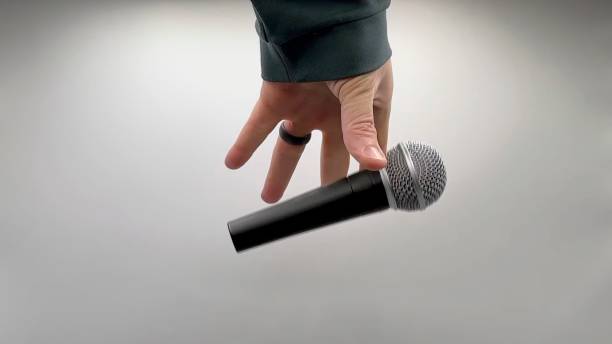 istock Drop the Mic on Sequence - Male Hand Black Mic 1475079122