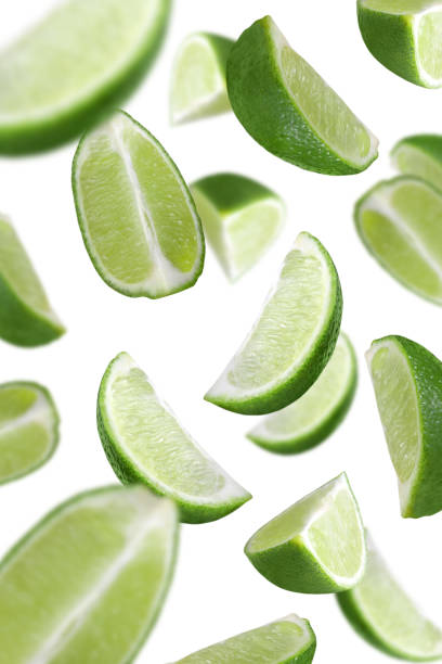 istock Levitation of lime slices isolated on white background. 1475079299