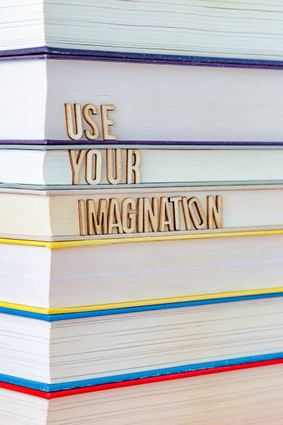 istock Stack of Books with letter tiles spelling the words 'Use Your Imagination' 1475079554