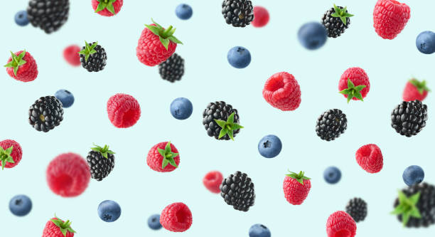 istock Colorful berry pattern of various fresh ripe wild berries on light blue background 1475080263