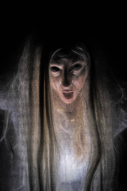 A creepy female spirit behind a veil of blackness.