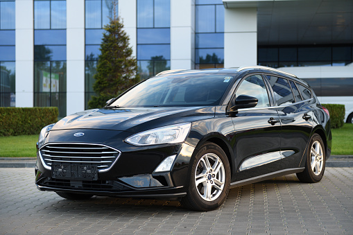 Belarus, Minsk - 23.09.2022: Black 2019 Ford Focus parked on the street in the city. Focus is one of the most popular compact cars.
