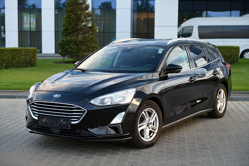 Belarus, Minsk - 23.09.2022: Black 2019 Ford Focus parked on the street in the city. Focus is one of the most popular compact cars.