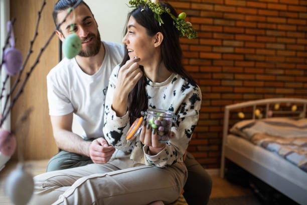 istock A young woman teasing her boyfriend with Easter candy 1475085566