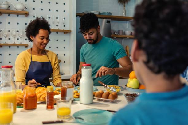 istock Happy black family having breakfast in the kitchen 1475089506