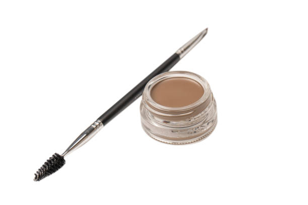 istock A brow pomade in blonde shade with brush isolated on a white background. 1475090462