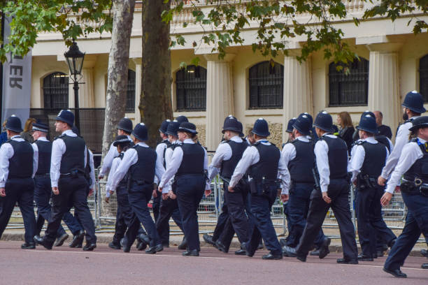 A group of Metropolitan Police officers in Central London London, UK - September 18 2022: a group of Metropolitan Police officers in Central London metropolitan police stock pictures, royalty-free photos & images