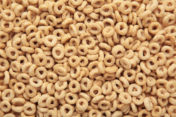 istock Beige oat cereal for a healthy cereal background 1475094597