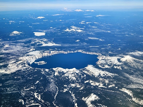 Aerial view of a wintery Crater Lake, OR.