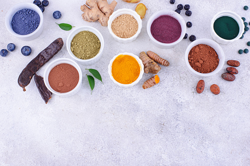 Various superfoods powder. Acai, matcha, spirulina, ginger, dried blueberry and turmeric