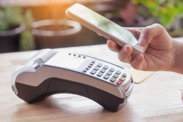 istock Contactless payment by smartphone. Payment with NFC technology 1475106187