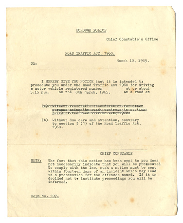 A typewritten letter notifying a British person in 1965 of the intention to prosecute him/her under the Road Traffic Act 1960 for driving a motor vehicle without due care and attention. All locations, names and other identifying text have been removed.