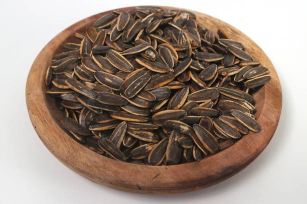 istock Sunflower seeds on white background. 1475107470