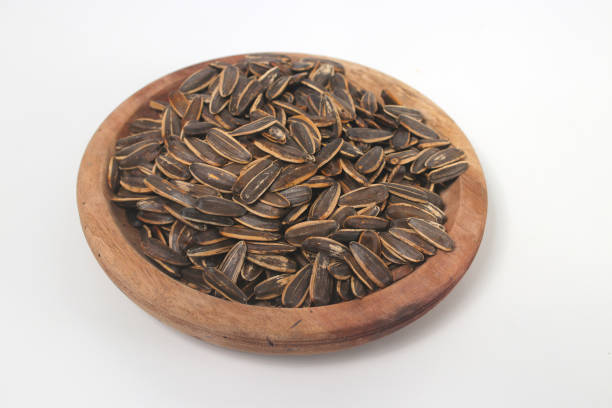 istock Sunflower seeds on white background. 1475107588