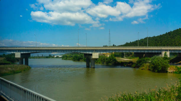 istock Railway bridge lake and sky landscape background 1475109402
