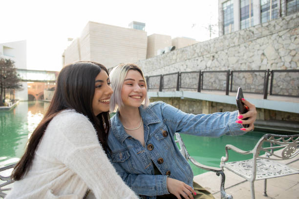 istock friends walking through the city 1475112834