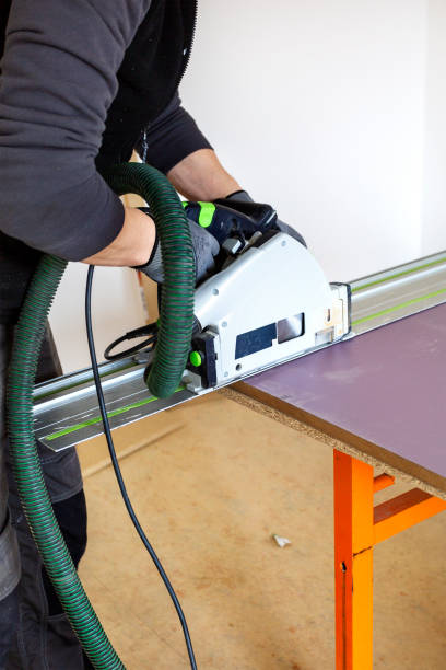 istock Sawing a wooden plank 1475113101