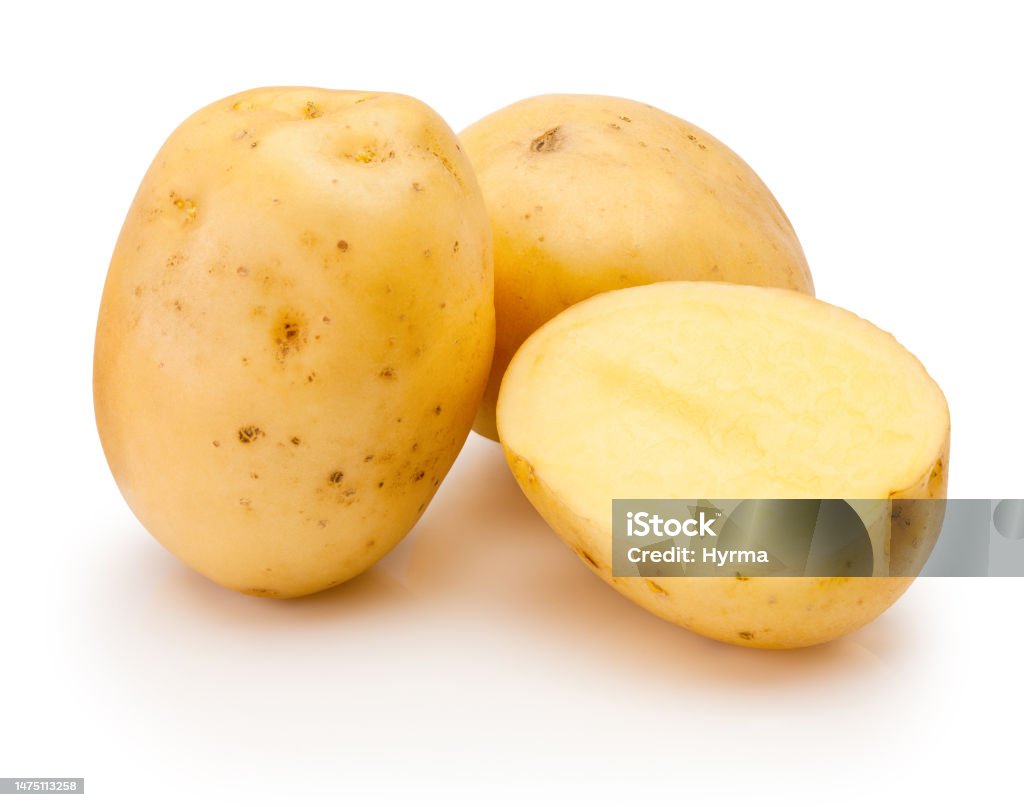 Raw potatoes freshly cut  in half isolated on white background Raw potatoes freshly cut  in half isolated on a white background Prepared Potato Stock Photo