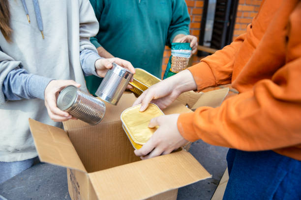 istock Unpacking food from donation boxes 1475114151