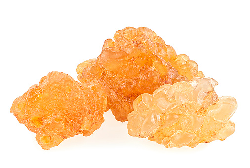 Pile of natural frankincense Olibanum isolated on a white background, incense. Frankincense resin.