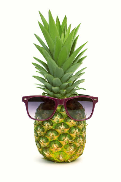Pineapple in sunglasses on a white background