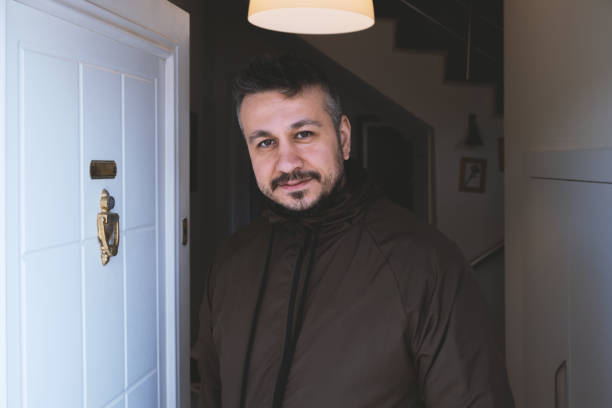 istock Man Standing In Front Of Door 1475117255