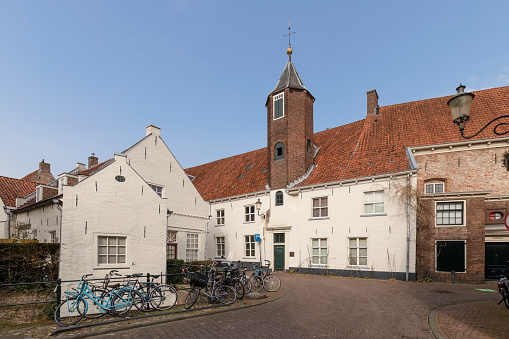White painted 16th century house with octagonal stair tower in the center of Amersfoort.
