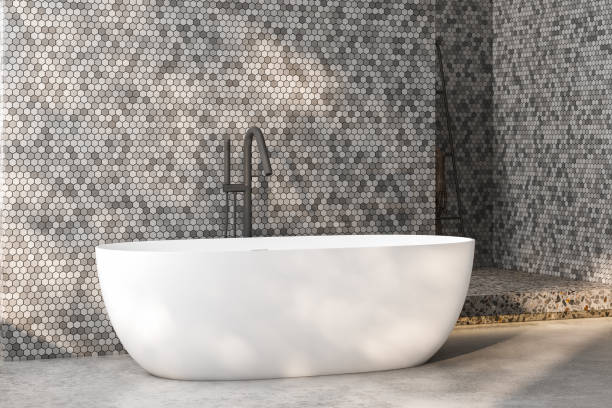 istock Side view of white bathtub on concrete floor in bathroom. 3d rendering 1475118645