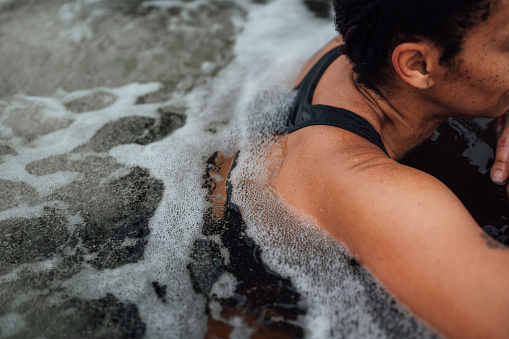 Woman relaxing in a hot tub