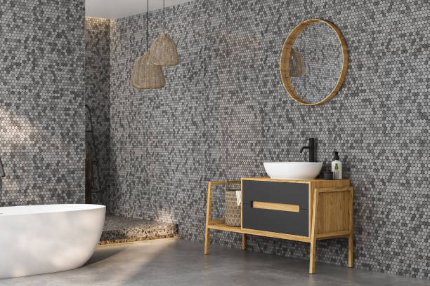 istock Modern minimalist bathroom interior, modern bathroom cabinet, white sink, wooden vanity, interior plants, bathroom accessories, bathtub and shower, black and tile walls, concrete floor. 3d rendering 1475119596