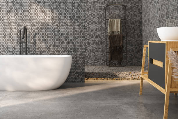 istock Modern minimalist bathroom interior, modern bathroom cabinet, white sink, wooden vanity, interior plants, bathroom accessories, bathtub and shower, black and tile walls, concrete floor. 3d rendering 1475119742