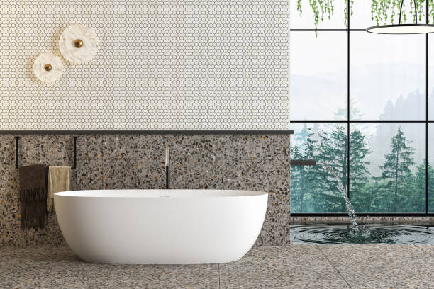 istock Beautiful white bathtub on terrazzo floor in modern bathroom with forest view from window, pool, towel, bath accessories, wall for mock up. 3d Rendering 1475121563