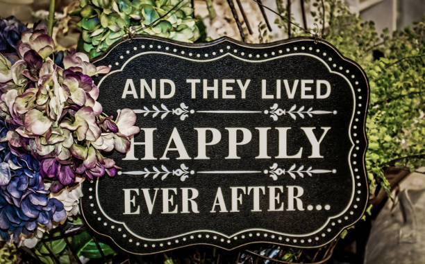 istock Sign saying And they Lived Happily Ever After surrounded by hydrangeals and ferns - Wedding 1475124213
