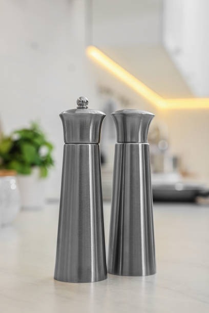istock Stainless steel salt and pepper shakers on table 1475125251