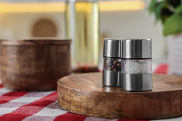 istock Metal salt and pepper shakers on table, space for text 1475125282