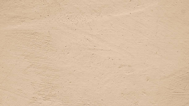 istock Light cement wall with crack peeling paint. Grunge vintage abstract pale beige background. 1475125961