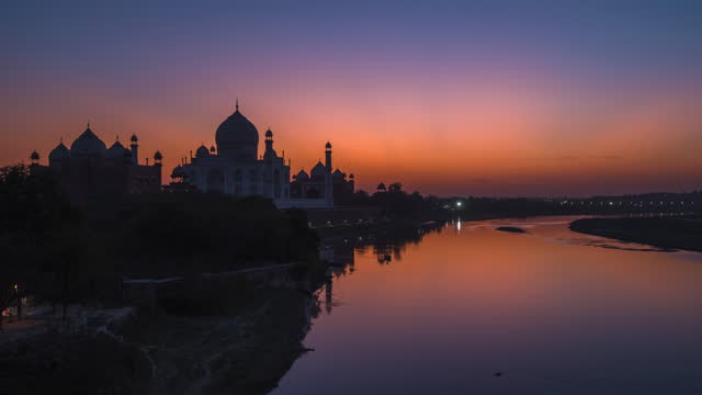 Timelapse View of Sunset Over the Taj Mahal and Yamuna River in Agra, India