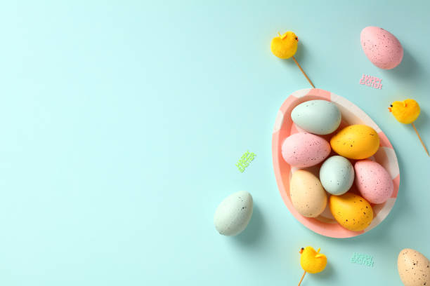 istock Happy Easter banner template. Easter eggs and plate in form of Easter egg on blue background. 1475126806