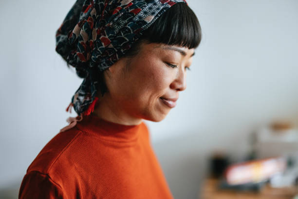 istock Smiling Woman Cooking Lunch At Home 1475127219