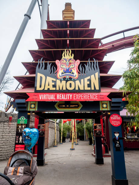 Entrance to The Daemonen (The Demon) Roller Coaster Copenhagen, Denmark - Oct 22, 2018: Entrance to The Daemonen (The Demon) Roller Coaster in the Tivoli Gardens Amusement Park. song title stock pictures, royalty-free photos & images