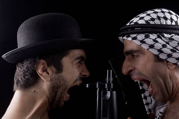 Man with hat and other in headscarf Confronting