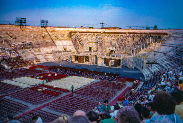 1989 old Positive Film scanned, roman amphitheatre - Verona Arena, Verona, Italy Verona, Italy - July 9, 1989: 1989 old Positive Film scanned, tourists are waiting for the start of the opera in the arena, Verona, Italy. verona opera stock pictures, royalty-free photos & images