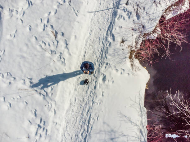 istock Aerial view of man piloting drone 1475130780