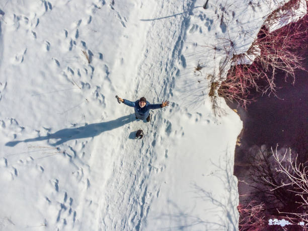 istock Aerial view of man piloting drone 1475130971